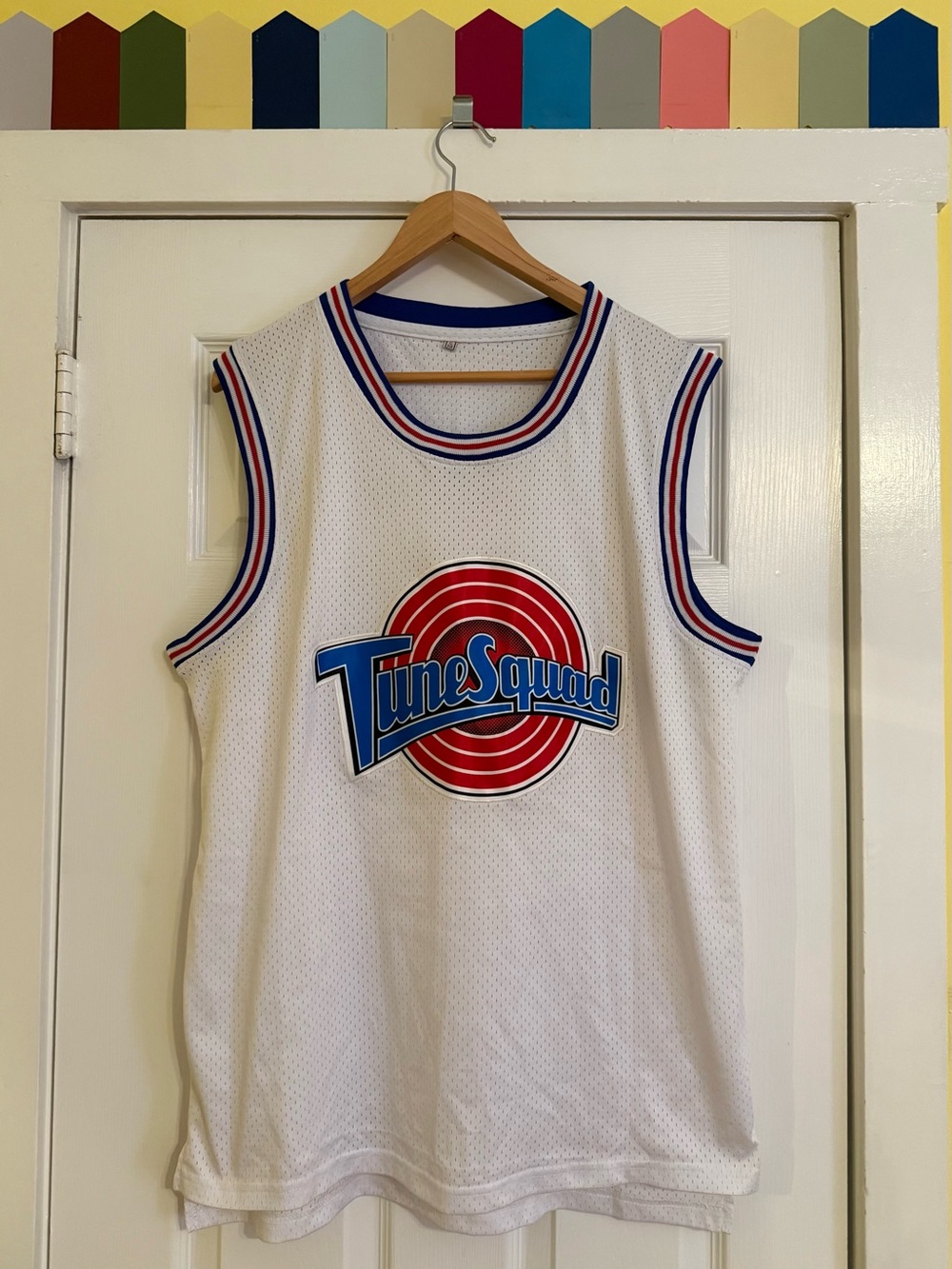 Tune Squad White Basketball Jersey with Red & Blue Logo